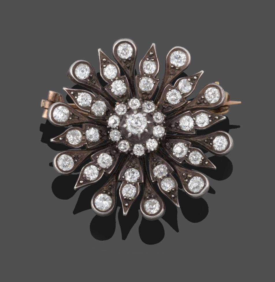 Lot 219 - A Victorian Diamond Flowerhead Brooch, a cluster of old cut diamonds within alternating pointed and