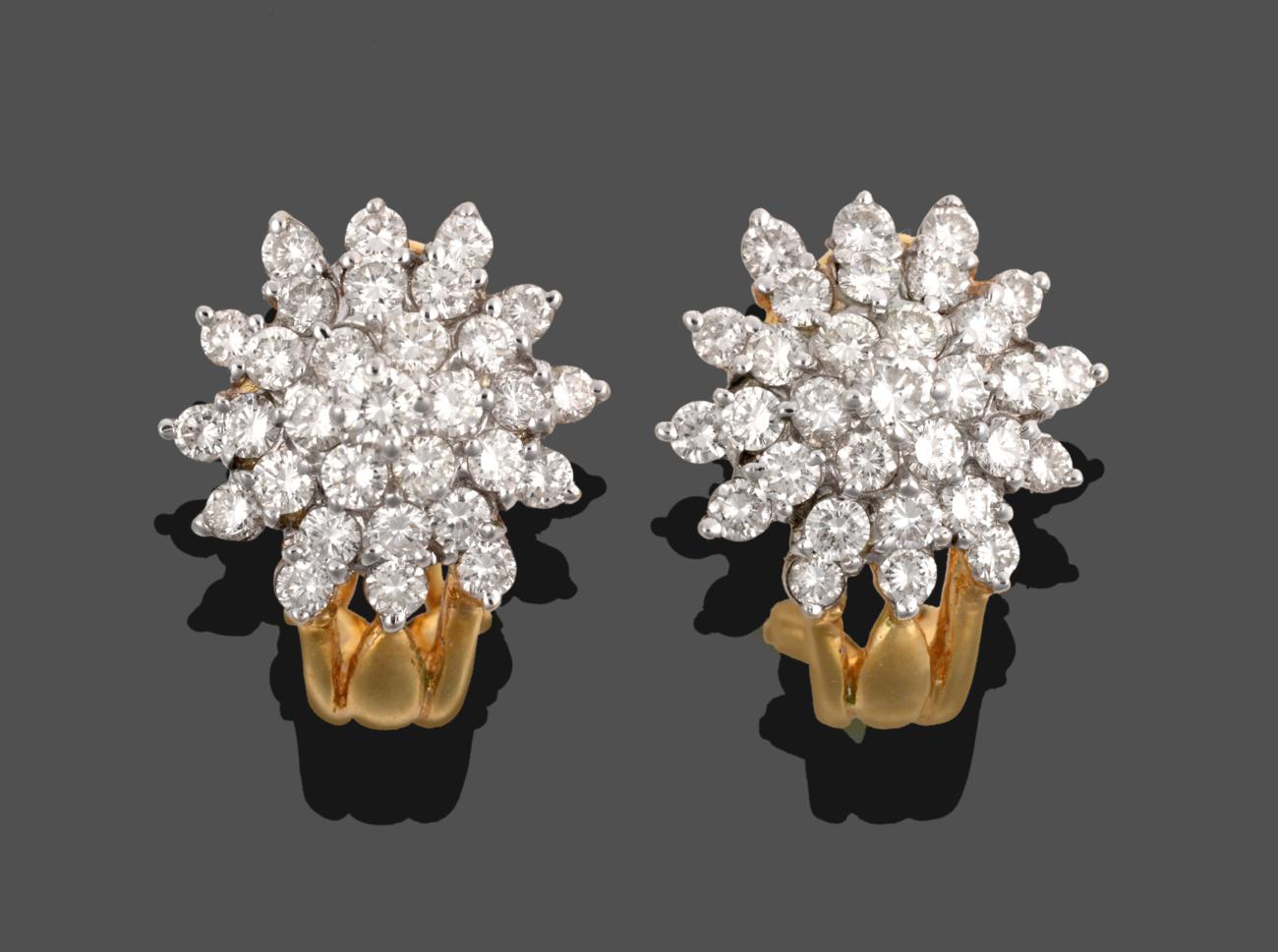 Lot 226 - A Pair of Diamond Cluster Earrings, the cluster of round brilliant cut diamonds in white claws,...