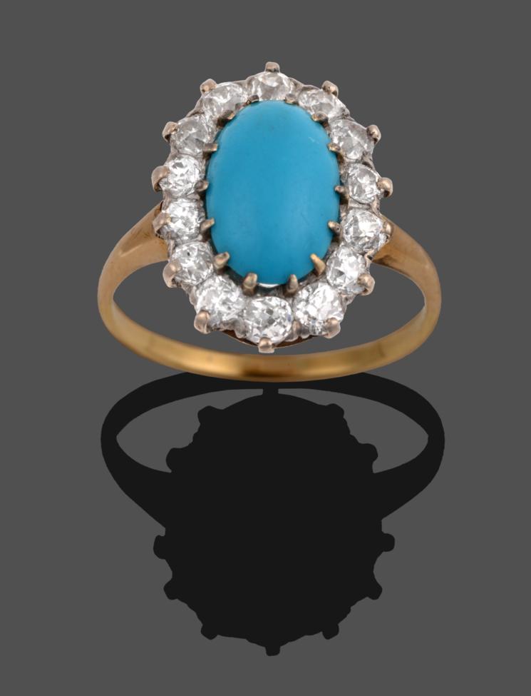 Lot 228 - A Turquoise and Diamond Cluster Ring, the oval cabochon turquoise within a border of round...