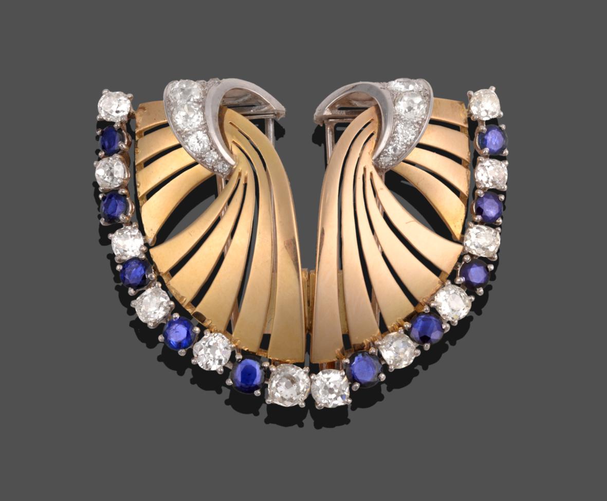 Lot 232 - A Sapphire and Diamond Double Clip Brooch, each clip as a stylised fan, the outer edge set with...
