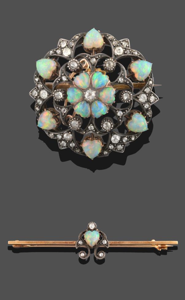 Lot 251 - An Opal and Diamond Brooch, circa 1900, comprised of an old cut diamond within six cabochon...