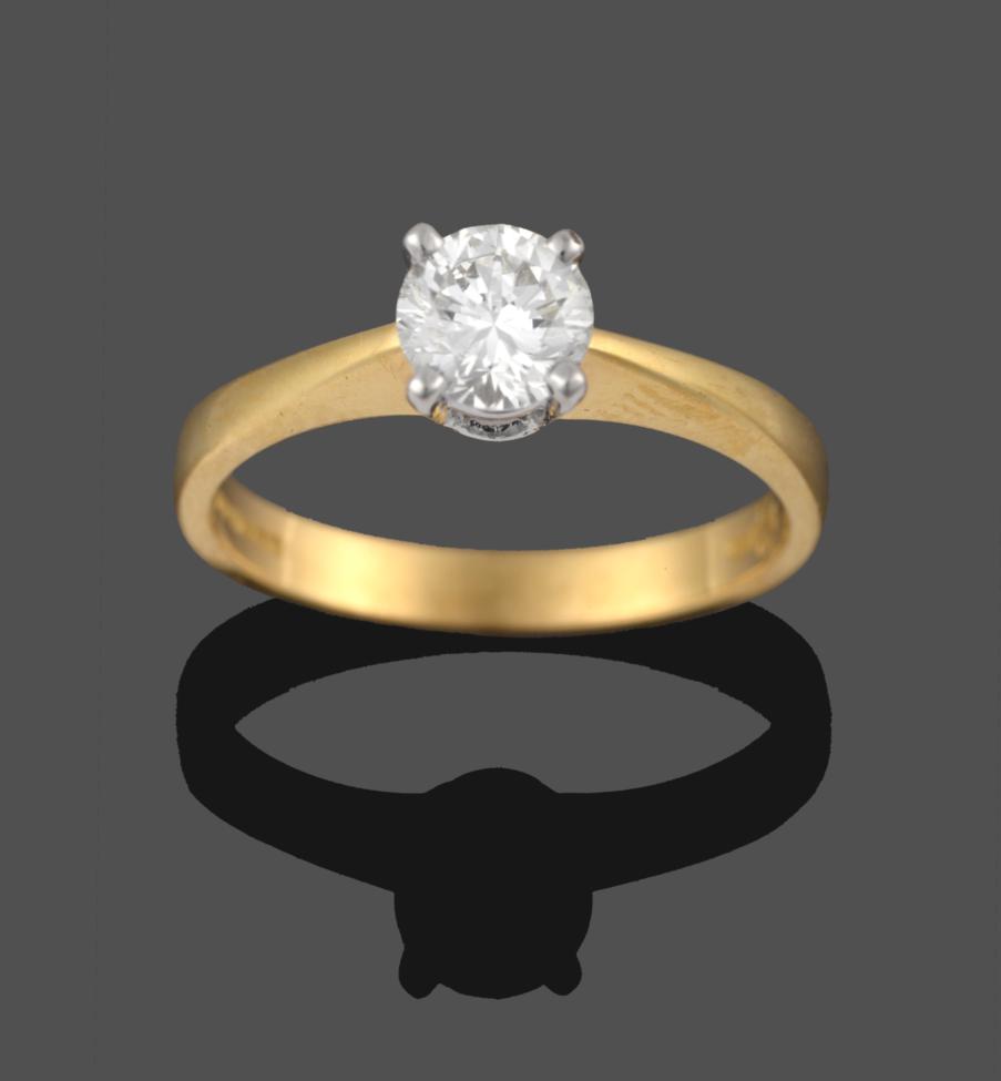 Lot 260 - An 18 Carat Gold Diamond Solitaire Ring, the round brilliant cut diamond in a white four claw...
