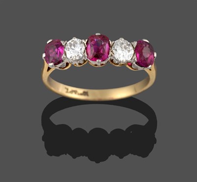 Lot 265 - A Ruby and Diamond Five Stone Ring, three oval cut rubies alternate with two round brilliant...