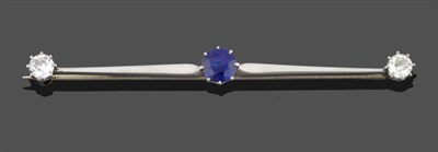 Lot 276 - A Sapphire and Diamond Bar Brooch, a round cut sapphire centrally, to tapered white bars, and...