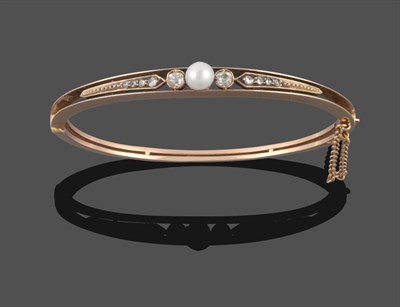 Lot 280 - A Pearl and Diamond Bangle, circa 1900, the central three-quarter pearl with a collet set old...