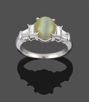 Lot 282 - A Chrysoberyl and Diamond Ring, the cabochon cat's-eye chrysoberyl in white claws, to a...