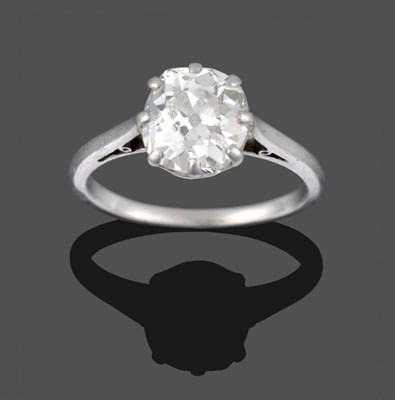 Lot 283 - A Diamond Solitaire Ring, the old cut diamond in a white claw setting to a tapered shoulder...