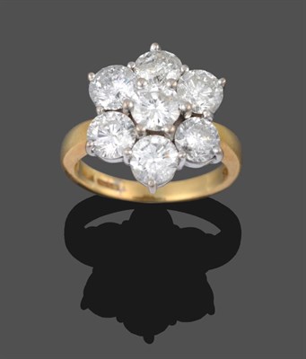 Lot 284 - An 18 Carat Gold Diamond Cluster Ring, seven round brilliant cut diamonds in white claw...