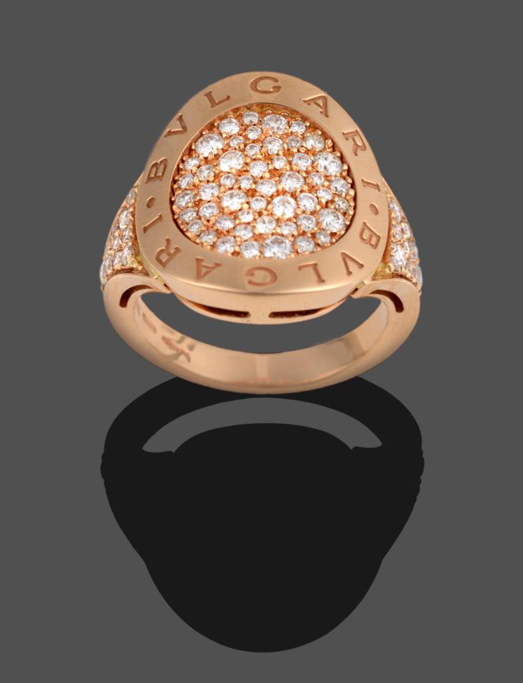 Lot 308 - A Diamond Ring, by Bulgari, a circular raised border engraved 'BVLGARI BVLGARI' enclosing pavé set