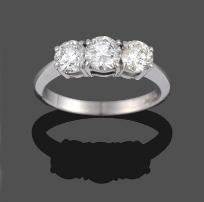 Lot 327 - An 18 Carat White Gold Diamond Three Stone Ring, the round brilliant cut diamonds in claw settings