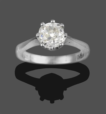 Lot 333 - A Diamond Solitaire Ring, an old cut diamond in a white claw setting, to a tapered shoulder...