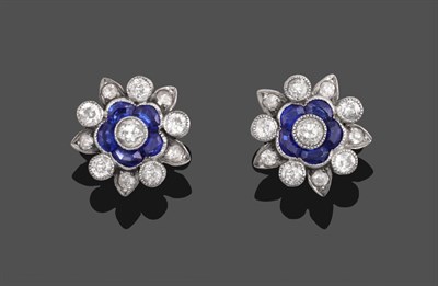 Lot 335 - A Pair of Early 20th Century Sapphire and Diamond Cluster Earrings, of floral forms, set with...