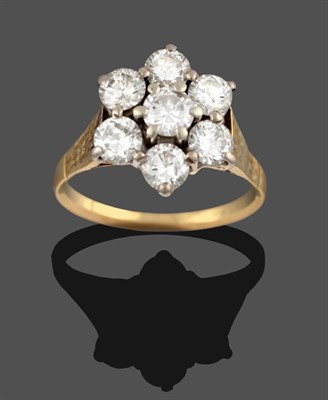 Lot 351 - A Diamond Cluster Ring, seven round brilliant cut diamonds in yellow claw settings, to a...