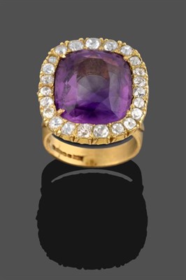 Lot 352 - An 18 Carat Gold Amethyst and Diamond Cluster Ring, the cushion cut amethyst within a border of old