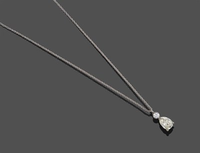 Lot 355 - A Diamond Pendant on an 18 Carat White Gold Chain, a round brilliant cut diamond in a white...