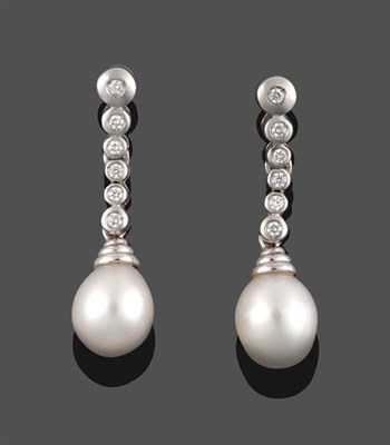 Lot 367 - A Pair of Diamond and Cultured Pearl Drop Earrings, a row of round brilliant cut diamonds in...