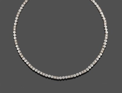 Lot 368 - An 18 Carat White Gold Diamond Necklace, by Links of London, trios of round brilliant cut...