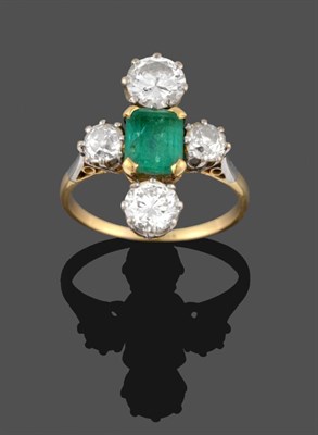 Lot 369 - An Emerald and Diamond Ring, the emerald-cut emerald in yellow claws, flanked by an old cut diamond