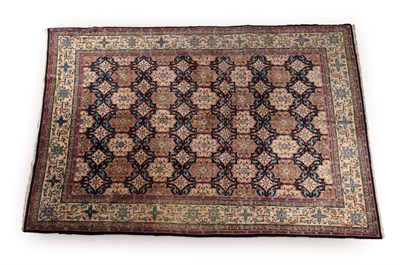 Lot 610 - Kashan Carpet Central Iran, circa 1940 The indigo lattice field of floral design enclosed by...