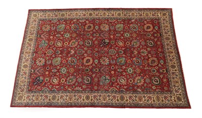 Lot 612 - Good Tabriz Carpet North West Iran, circa 1950 The brick red field with an allover Shah Abass...