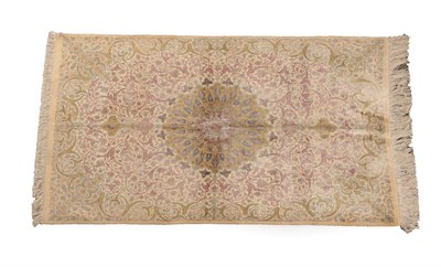 Lot 614 - Finely Knotted Ghom Silk Rug Central Iran, modern The ivory field centred by a flowerhead medallion