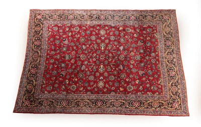 Lot 615 - Kashan Carpet Central Iran, circa 1940 The crimson field with an allover design of palmettes...
