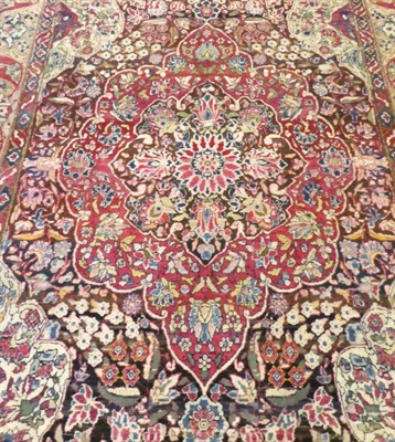 Lot 626 - Isfahan Rug Central Iran, circa 1925 The abrashed walnut brown field centred by a cusped...