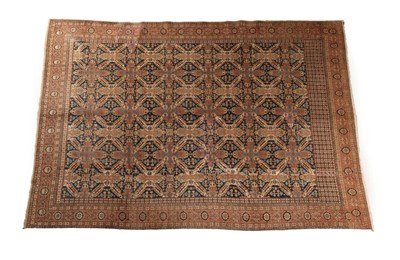 Lot 627 - Khoy Carpet North West Iran, circa 1950 The indigo diamond lattice field of cruciform motifs...