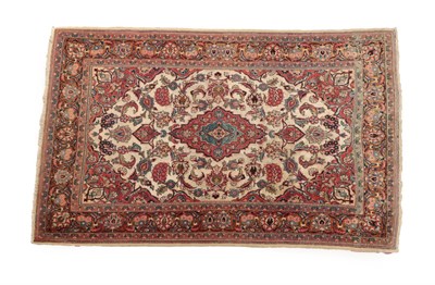 Lot 629 - Rare Part Silk Kashan Rug Central Iran, circa 1930 The ivory field and palmettes and vines around a