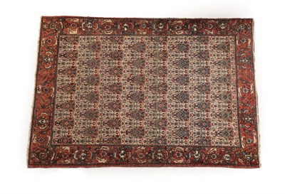 Lot 631 - Bakhtiari Rug West Iran, circa 1940 The cream field with rows of urns issuing flowers enclosed...
