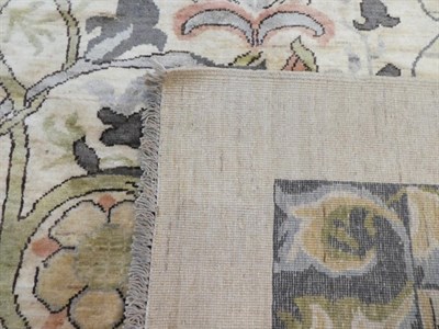 Lot 633 - William Morris Design Carpet, modern The ivory field with large scrolling vines enclosed by borders