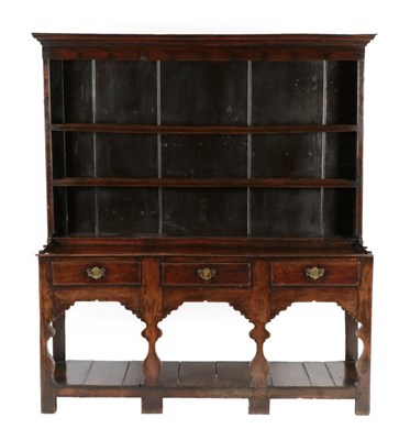 Lot 655 - An 18th Century Joined Oak Open Dresser and Rack, with two fixed shelves, the base of three...