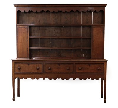 Lot 656 - A Mid 18th Century Oak and Mahogany Crossbanded Dresser and Rack, the moulded cornice above a...