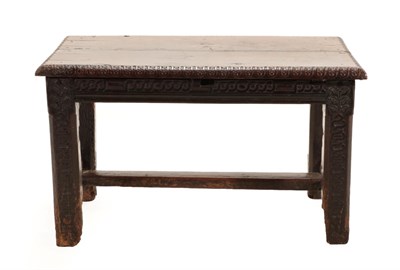 Lot 658 - A 17th Century Oak Table, of rectangular form, with leaf carved border above a guilloche carved...