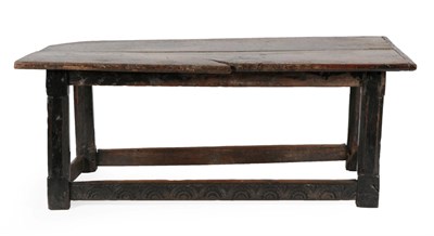Lot 659 - A 17th Century Joined Oak Refectory Table, the top of two plank construction with one cleated...