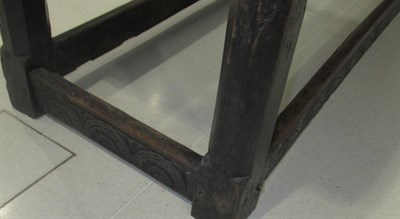 Lot 659 - A 17th Century Joined Oak Refectory Table, the top of two plank construction with one cleated...