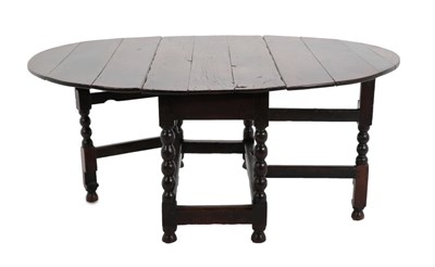 Lot 660 - A Late 17th Century Six-to-Eight Seater Gateleg Dining Table, with two drop leaves to form an oval