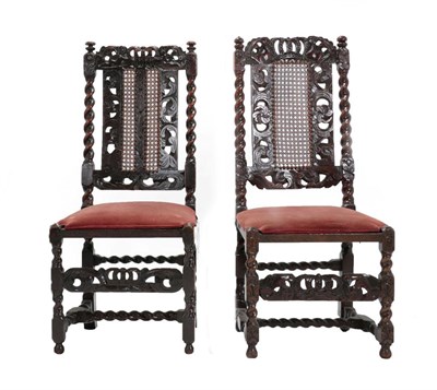Lot 665 - Two William & Mary Walnut Chairs, late 17th century, each with caned seat and back flanked by...