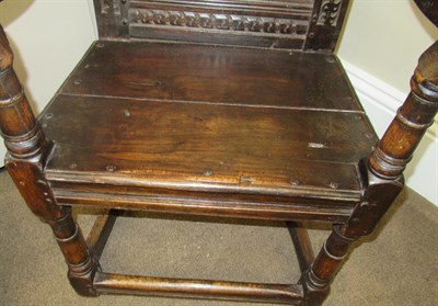 Lot 670 - A 17th Century English Joined Oak Armchair, probably North Country, with turned finials above a...