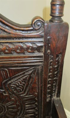 Lot 670 - A 17th Century English Joined Oak Armchair, probably North Country, with turned finials above a...