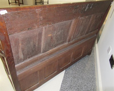Lot 675 - A Joined Oak Settle, the nulled top rail above four fielded panels carved with tulips and...