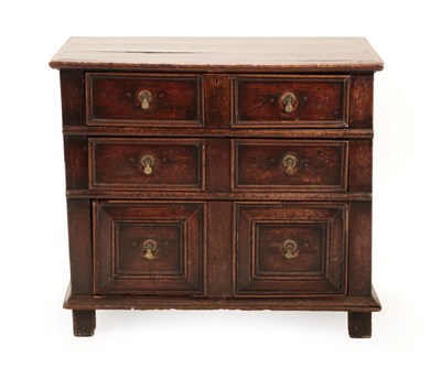 Lot 676 - A 17th Century Joined Oak Chest, with three graduated two-as-one drawers above a moulded plinth...