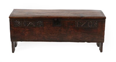 Lot 678 - An Oak Chest, dated and initialled 1701 EAT, of six plank construction, the hinged lid above an...