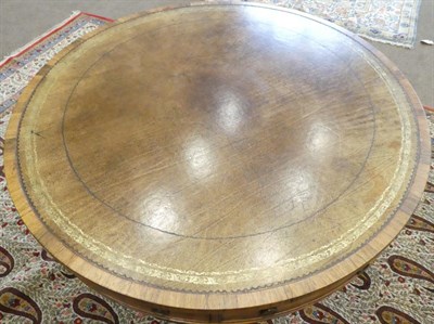 Lot 684 - A Regency Rosewood Revolving Drum Table, early 19th century, the brown and gilt leather surface...