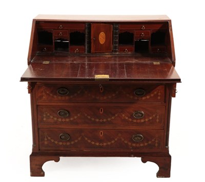 Lot 686 - A Mahogany and Marquetry Inlaid Bureau, the fall richly inlaid with an urn and flower garlands...