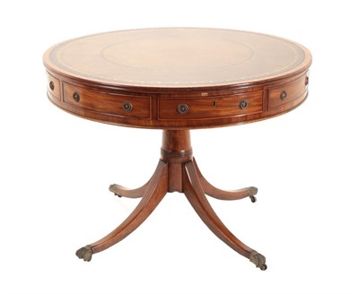 Lot 698 - A George III Mahogany Revolving Library Table, circa 1800, with brown and gilt tooled leather...