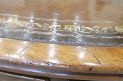 Lot 698 - A George III Mahogany Revolving Library Table, circa 1800, with brown and gilt tooled leather...