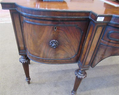 Lot 700 - An Early 19th Century Mahogany and Ebony Bowfront Sideboard, with central drawer above a...