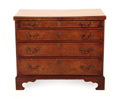 Lot 701 - A Burr Walnut, Crossbanded and Tulipwood Banded Straight Front Bachelor's Chest, the hinged lid...