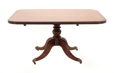 Lot 710 - A Regency Mahogany and Rosewood Crossbanded Pedestal Dining Table, early 19th century, of...